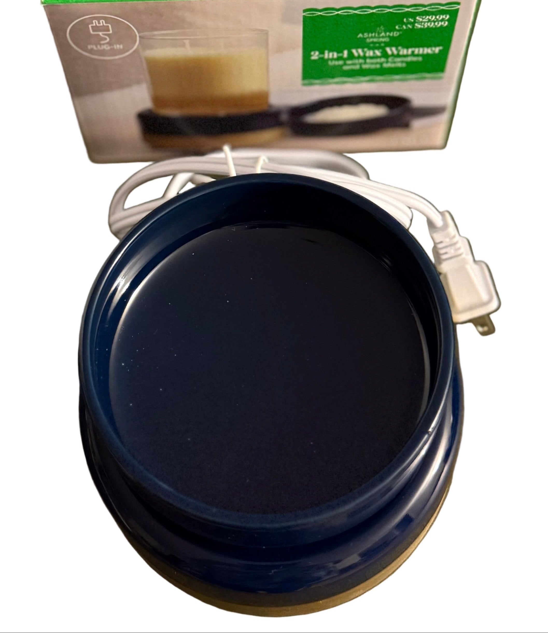 2 in 1 wax/candle warmer with electric cord and box in the background